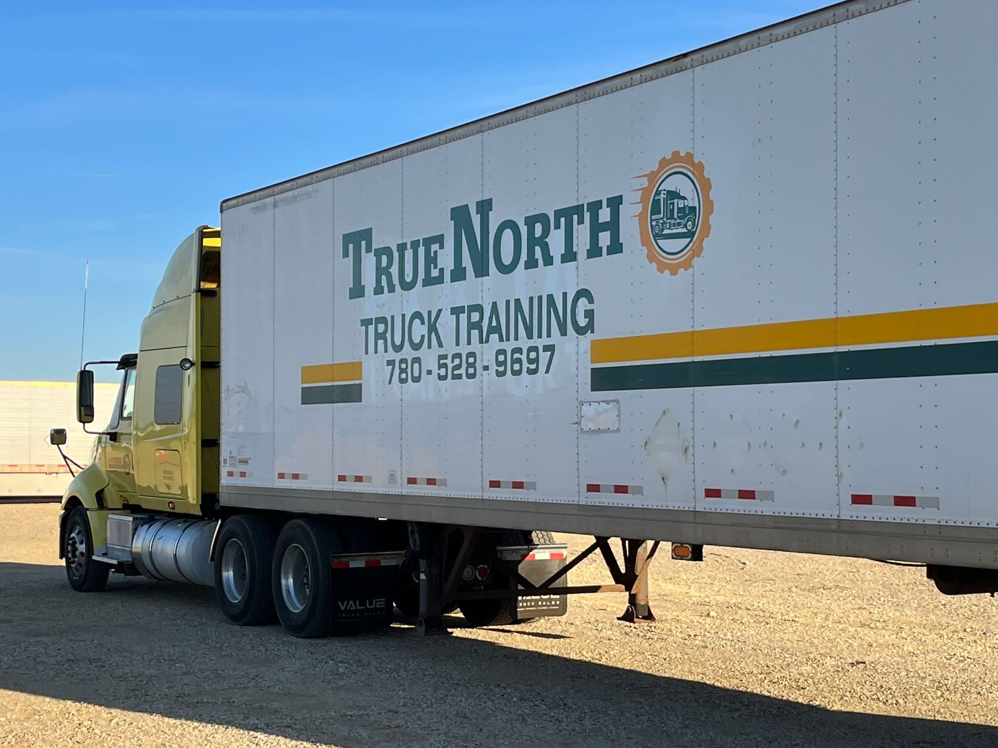 True North Truck Training semi-truck and trailer parked in a lot